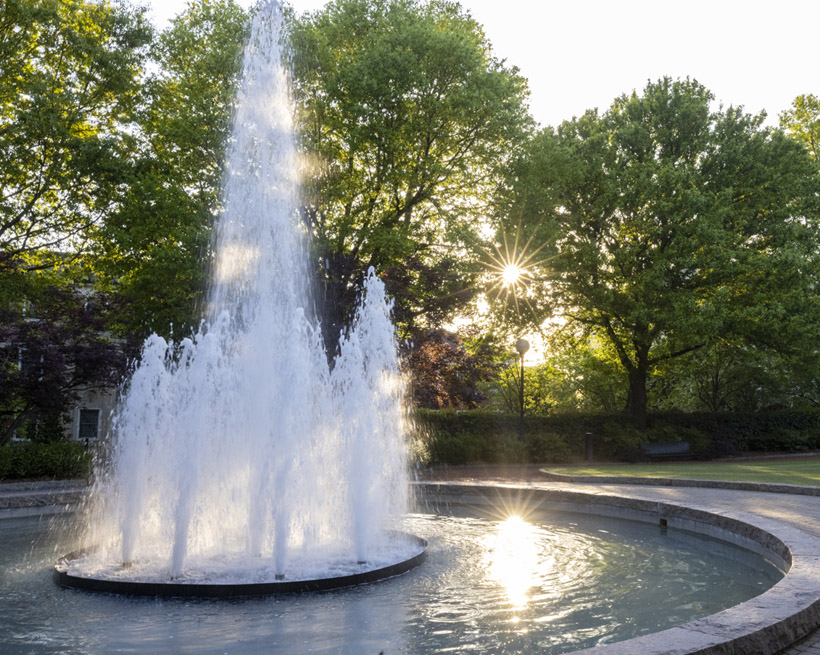 Campus scenic of the Sun setting over Herty Field during Spring.