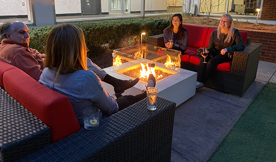 Courtyard Firepits at the Georgia Center. People enjoying the firepits.